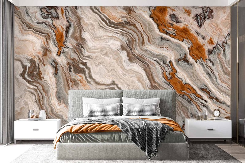 The wallpaper behind the bed features a striking, abstract marble design with elements in shades of orange, brown, beige, and gray.