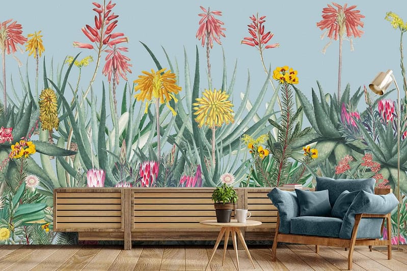 Vibrant mural featuring large, colorful flowers and lush green leaves. The wallpaper includes bold hues like red, yellow, blue, pink, and varying shades of green. It creates a lively and natural ambiance perfect for relaxation.