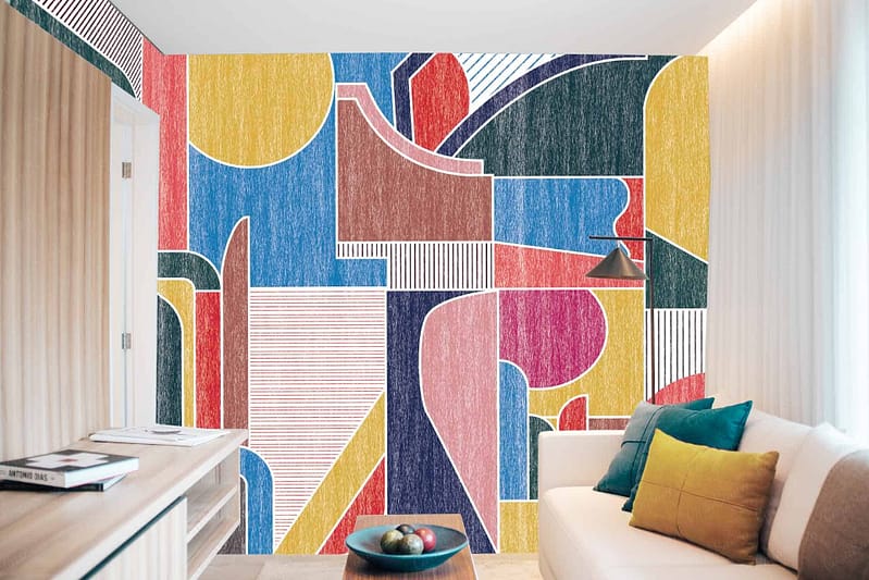 A modern room's wall is adorned with a tailor-made, colorful abstract mural. This eye-catching wallpaper features geometric shapes in bold blue, yellow, red, and green hues.