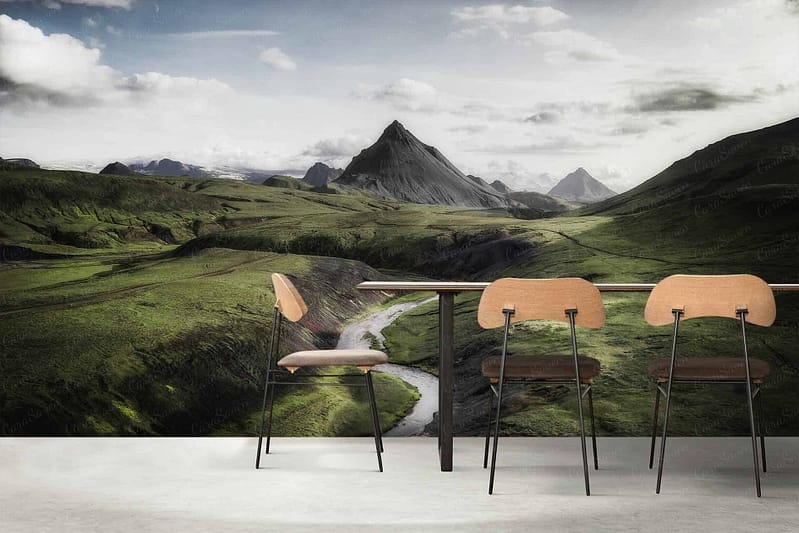 Lush green valley, winding river, pointed mountains yonder, vibrant landscape, scenic mural.