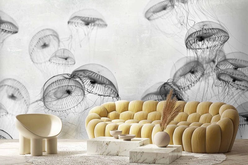 The wallpaper features translucent jellyfish swimming gracefully, creating an ethereal, aquatic ambiance. Elements include delicate tentacles and softly glowing bell-shaped bodies. The primary colors are shades of blue and aqua, with subtle hints of luminescent white and soft coral highlights. This dynamic composition gives the impression of movement and tranquility within an underwater scene.