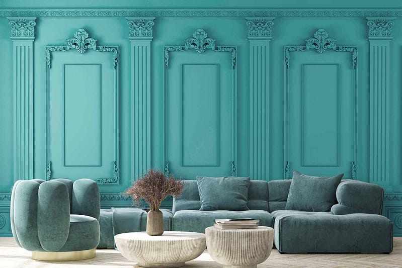 The wallpaper features intricate gold filigree patterns and teal floral motifs, creating a rich backdrop. Its elegant design complements the opulent Versailles-inspired aesthetic, while the combination of shimmering gold and deep teal accents adds a touch of luxury to the living room.