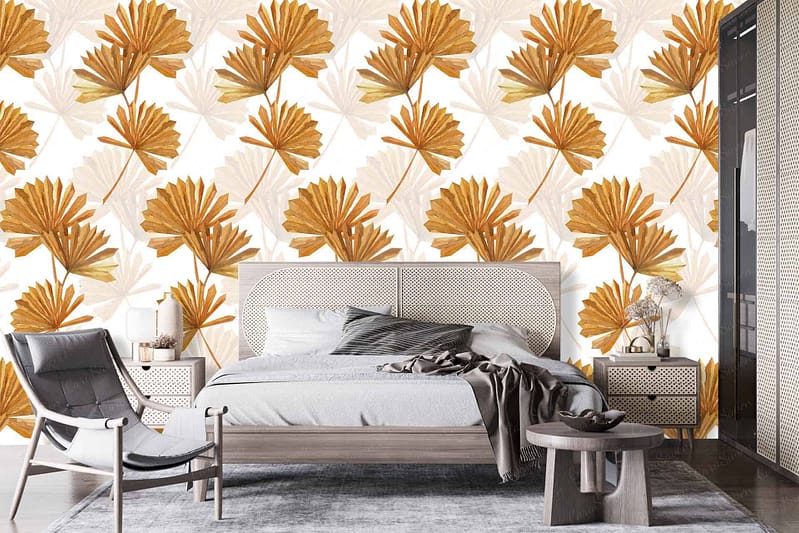 The wallpaper features a bold pattern of large, golden leaves.