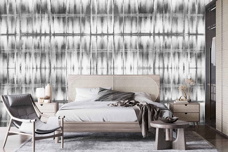 The modern bedroom features a gray and white abstract wallpaper. The wallpaper showcases intricate swirling patterns, combining shades of light and dark gray with crisp white accents. It combines geometric shapes with fluid designs, giving it both a contemporary and dynamic feel.