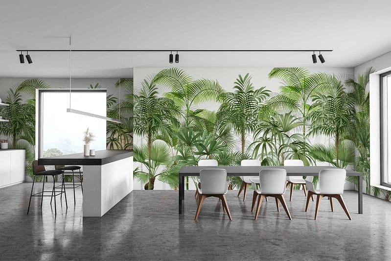 The tropical-themed wall mural in the modern kitchen and dining area features vibrant green plants, including palm fronds, monstera leaves, and ferns. Hues of emerald, lime, and forest green dominate the design. Accents of soft beige and subtle yellow mimic natural sunlight filtering through foliage. This lush backdrop adds an invigorating touch to the minimalistic space, complementing elements like the white chairs and inviting ambiance created by large windows.