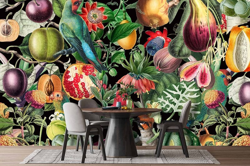 The wallpaper showcases a vibrant and eclectic mural featuring various fruits, vegetables, flowers, and birds. Elements include apples, oranges, grapes, carrots, daisies, roses, sunflowers, sparrows, and peacocks. Colors range from bright reds and oranges to deep purples and greens with splashes of blue and yellow. The overall style is reminiscent of traditional Japanese aesthetics.