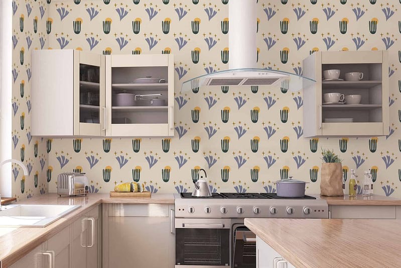 The wallpaper in the modern kitchen prominently features a vibrant pattern of blue and yellow tulips reminiscent of "Song of Songs." The colors are rich and lively, with shades of cobalt blue and buttery yellow creating a striking contrast. Green leaves add an extra layer of freshness to the design, while delicate vine motifs weave through the floral patterns, adding an elegant touch. This wallpaper serves as a lively backdrop against which light wood and white cabinetry, as well as stainless steel appliances, stand out beautifully.