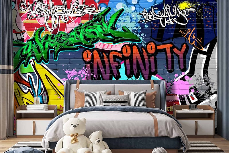 A bedroom with modern design features a large mural of vibrant, colorful graffiti art. The wallpaper showcases an array of bold elements like abstract shapes, dynamic lines, and striking patterns. Prominent colors include electric blue, neon pink, bright yellow, and eye-catching orange. Pops of green and splashes of red add further contrast to the energetic composition. This graffiti mural brings street cred to the space through its vivid hues and urban artistry.
