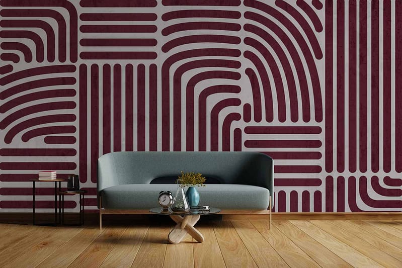 Bold accent wall with intricate maroon and white geometric pattern. The wallpaper features a harmonious blend of maroon and white elements, creating a striking visual appeal.