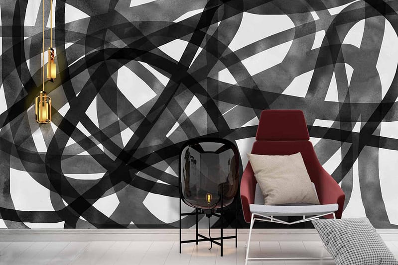 The wallpaper features swirling, overlapping black and white lines, creating a dynamic abstract design. Elements include bold black lines contrasted by crisp white spaces. The overall pattern is reminiscent of lively, energetic influences.