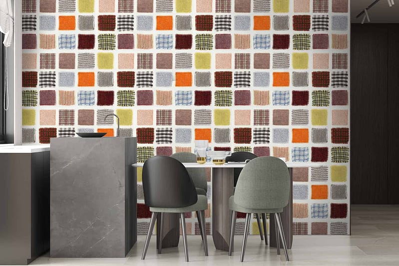 The wallpaper features a colorful patchwork pattern of various squares in earth tones, including orange, red, and gray.