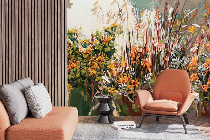 The wallpaper showcases a vibrant floral mural with dominant colors of orange, yellow, and white flowers. These elements add a lively touch to the space.