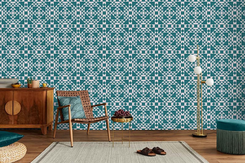 A stylish living room featuring **teal and white geometric patterned wallpaper**, creating a modern and vibrant backdrop. The **geometric shapes** in the wallpaper add depth, while the **teal and white colors** blend harmoniously to set a contemporary tone for the space.