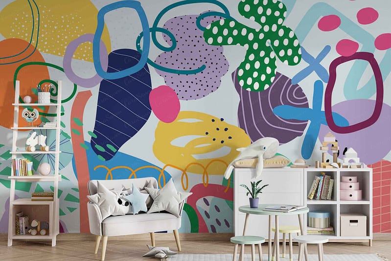 The children's playroom wallpaper is adorned with colorful abstract wall art featuring a dynamic array of shapes and patterns. You'll find vibrant hues like red, blue, yellow, green, and orange. The designs include stars, circles, triangles, squiggly lines, and polka dots. This lively mix creates an energetic and playful background perfect for inspiring the imagination.