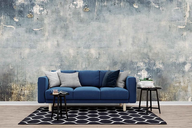 The wallpaper in the modern living room has a textured, distressed look. The colors are mainly earthy and muted tones, featuring shades of gray, beige, and subtle hints of faded blue. The texture resembles aged plaster or weathered concrete.