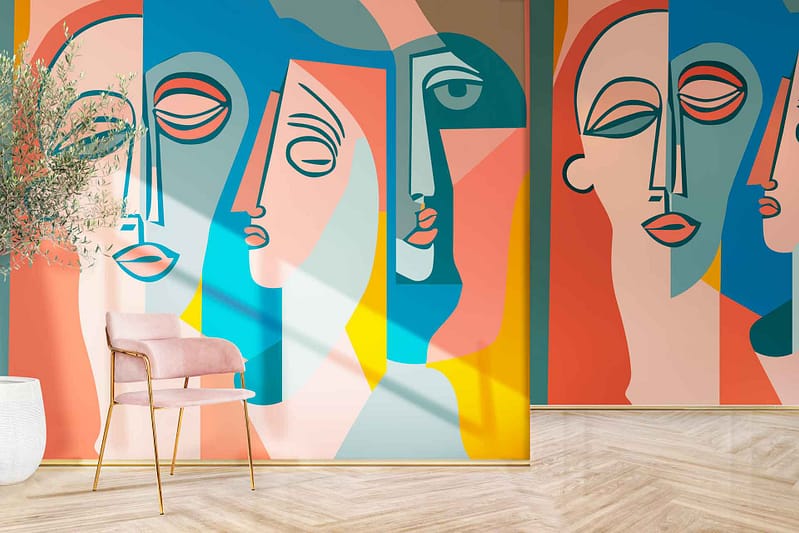 Face It" mural, vibrant abstract faces, pink hues, blue hues, yellow hues, teal hues.