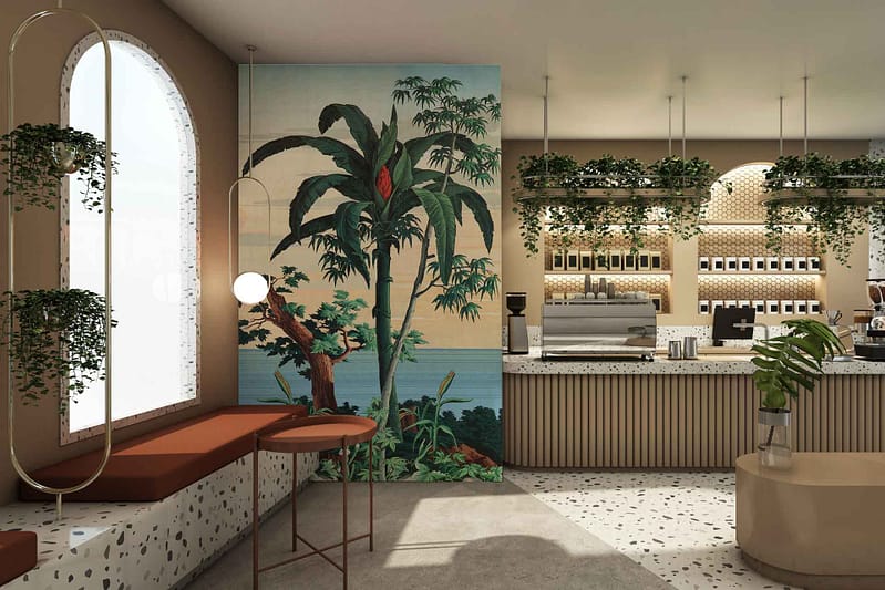 The wallpaper in The Traveller cafe features a large mural of tropical plants and an ocean view. Key elements include lush green leaves, vibrant flowers in various hues, shades of blue depicting the sea, and touches of sandy beige representing the shoreline.