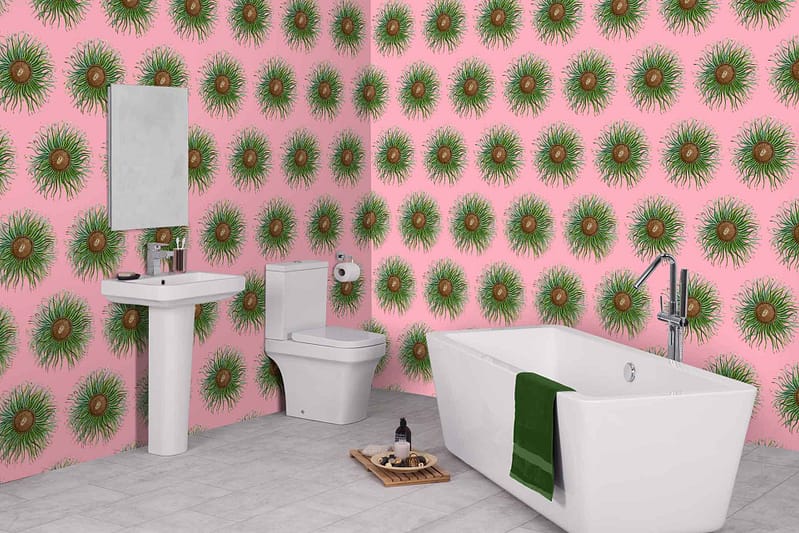 The bathroom features bright pink wallpaper with a striking green and yellow sunburst pattern.