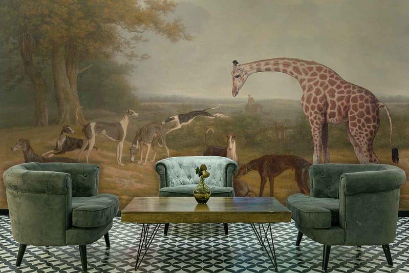 The wallpaper features a detailed, large mural of a savanna scene with dogs, giraffes, and other animals under trees. Colors include earthy tones of greens and browns for the vegetation and animals against a muted background.