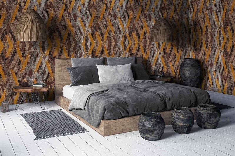 Textured wallpaper with a dynamic orange and brown pattern. Rich, earthy tones of burnt orange and deep brown create a creative feel. The design incorporates flowing shapes and intricate detailing, adding depth and warmth to the room.