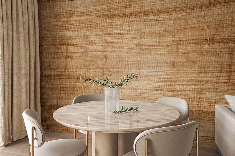 The wallpaper is textured and tan-colored, featuring subtle imperfections that add a charming touch.