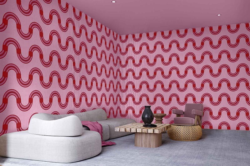 The wallpaper features a modern design with pink and red wavy patterns reminiscent of Japanese textile art. The colors prominently include shades of pink and red, arranged in undulating, wave-like motifs that evoke traditional Japanese aesthetics.