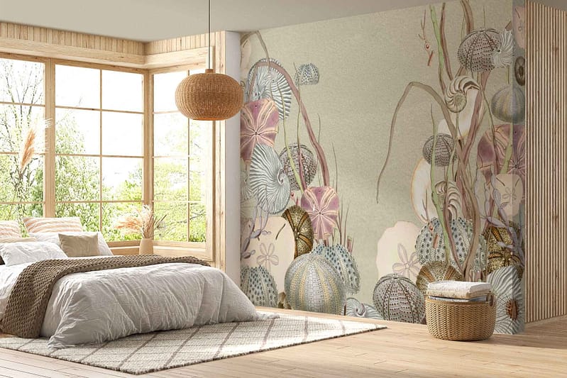 The wallpaper in the cozy bedroom features a nature-themed mural with various plants and abstract designs. It showcases vibrant green foliage akin to equatorial greenery. The colors include multiple shades of green, earthy browns, and subtle hints of blue and yellow, capturing the essence of a lush natural environment.