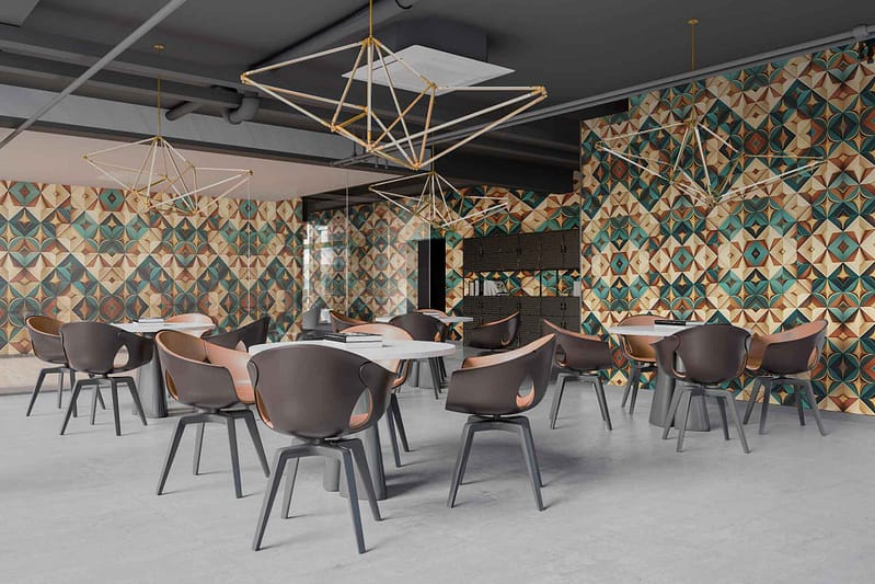 The café interior features wallpaper with geometric patterns in earthy tones. The design includes a mix of triangles, hexagons, and polygons. Dominating colors are muted browns, beiges, olive greens, and deep terracotta. This modern pattern brings a chic touch to the space while maintaining a warm and inviting atmosphere.