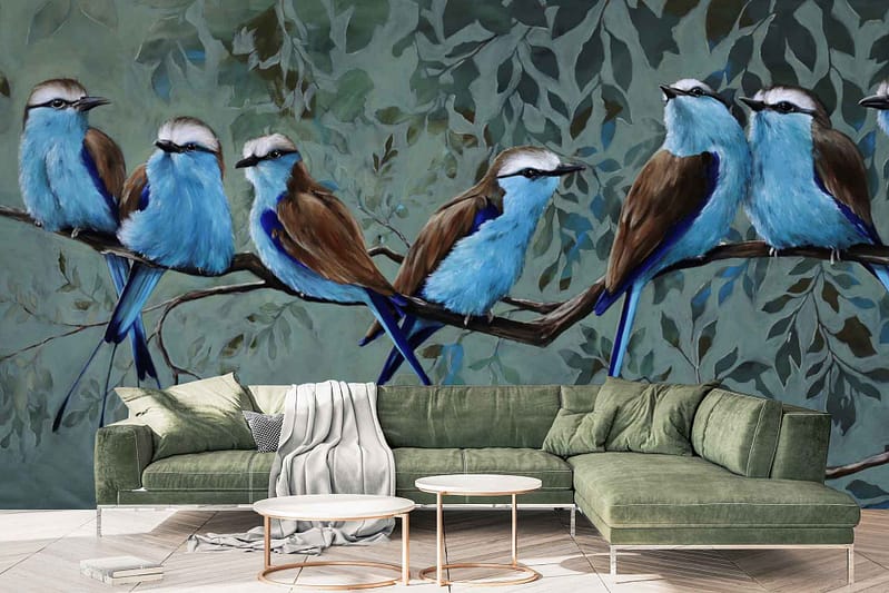 Wall mural featuring blue and brown birds perched on branches with a leafy background. Colors include shades of blue, brown, green, and natural wood tones. The design is nature-inspired, bringing an essence of tranquility through detailed depictions of birds and foliage.