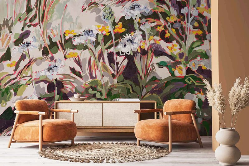 The wallpaper is an abstract floral mural with vibrant splashes of green, red, and white inspired by Pincushion Proteas. It's characterized by bold strokes and intricate patterns, showcasing the lively essence of the flowers. Key elements include vivid greens mirroring the foliage, striking reds for petals, and soft whites adding depth and accents to capture a dynamic yet harmonious nature scene.