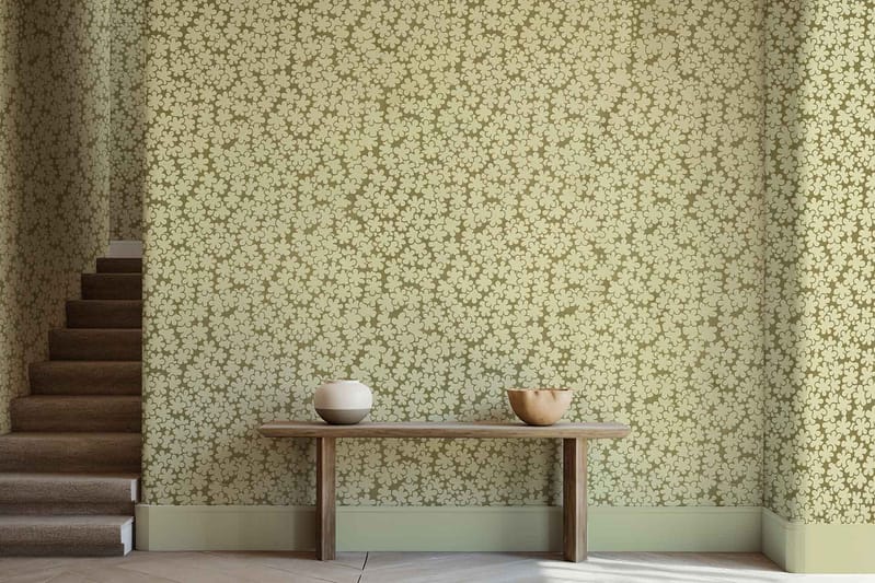 The wallpaper is a green floral-patterned design reminiscent of the Posy Club's style. This elegant wallpaper features detailed floral motifs in various shades of green.