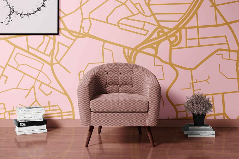 The wallpaper features a pink background with a solid gold map design.
