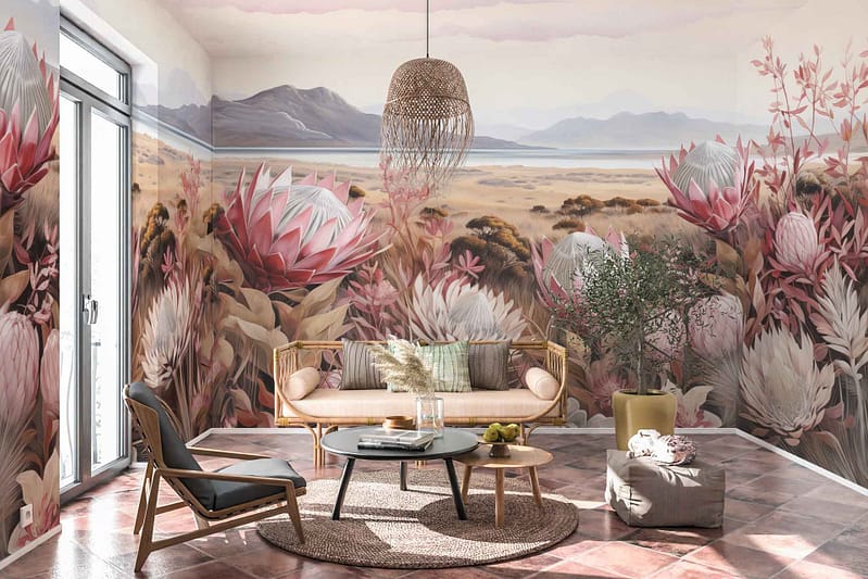 A desert-themed mural features large pink and white flowers, dry grasses, and distant mountains.