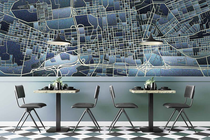 The wallpaper is a detailed city map design in blue and white tones. Elements include intricate street layouts, landmarks, and geographic markers. Colors primarily feature varying shades of blue contrasted with crisp white lines and spaces.