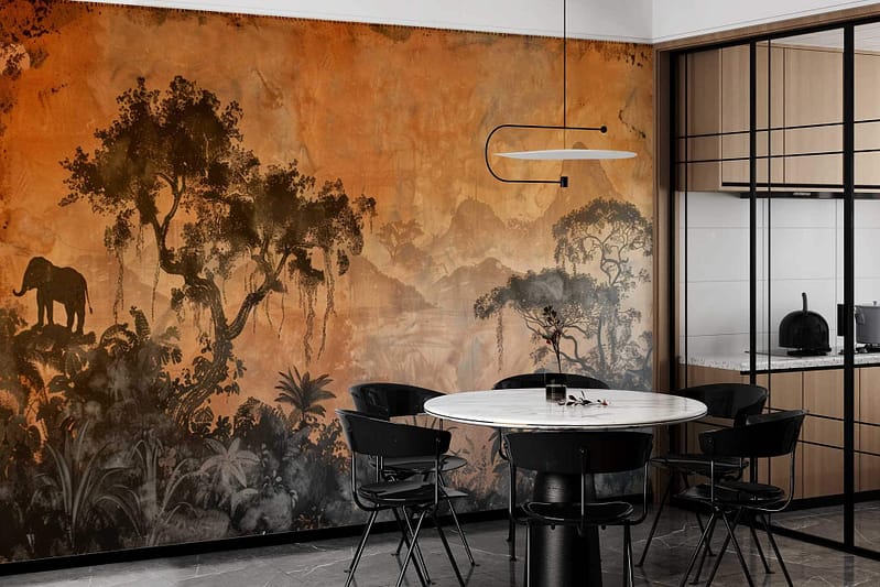 African Dream" dining area wallpaper features a vivid African savanna with earthy tones of orange, gold, and brown. Prominent acacia trees and an elephant silhouette stand against a sunset sky with gradient hues from warm yellow to deep crimson. The scene is rich in texture and detail, capturing the wild beauty of Africa’s landscape. Adventure and serenity blend seamlessly through this striking wall mural.