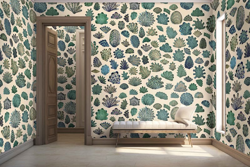 Colorful coral reef patterned wallpaper: vibrant corals in hues of pink, orange, and red; seaweed in shades of green and blue; various tropical fish with yellow, blue, and purple scales; turquoise water backdrop.