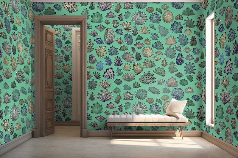 A room with vibrant, sea-themed wallpaper featuring an array of colorful corals on a teal background. The design includes reds, oranges, yellows, and purples set against various shades of teal.
