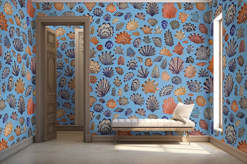 Blue wallpaper adorned with colorful coral patterns.