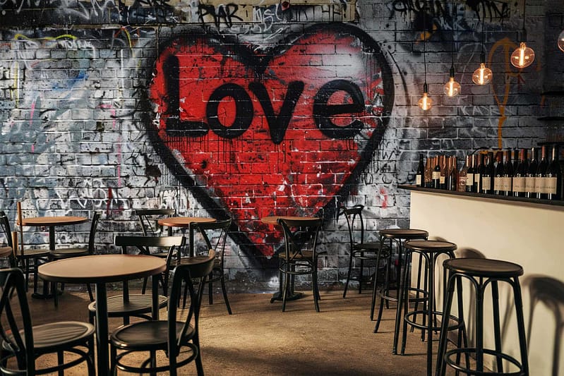 Graffiti-style mural, brick wall, red heart, "Letter to My Love" text, urban art elements.