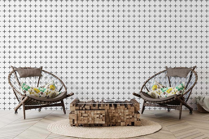 The wallpaper features a geometric pattern with interlocking hexagons and triangles. The design showcases shades of soft gray, muted blue, and warm beige. Thin metallic gold lines accentuate the shapes, adding a subtle touch of elegance to the modern living room.