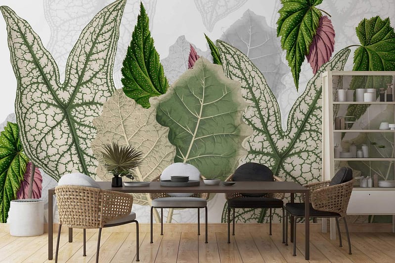 A dining room with a wall mural showcasing green and beige leaves, along with peony buds in similar tones. The wallpaper prominently features foliage and buds, blending shades of green and beige.