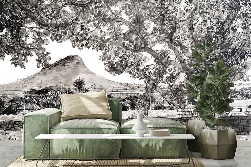 The wallpaper dominates the room with a stunning monochrome mural, capturing the essence of a majestic mountainous landscape. Shades of black, white, and varying grays blend harmoniously to depict towering mountains adorned with lush trees. A delicate fence meanders through the scene, adding depth and intrigue to the composition. This grayscale design casts an elegant and timeless atmosphere over the living space.