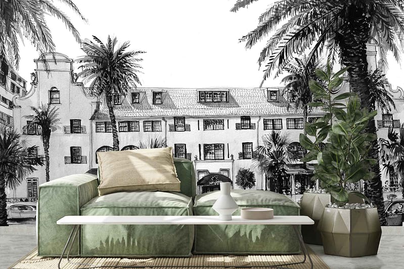 The wallpaper showcases a grand building framed by lush palm trees. The design features an elegant blend of muted earth tones, with sandy beige and soft greens dominating the scene. Hints of terracotta and warm browns add depth, while the foliage introduces vibrant shades of green, creating a serene yet opulent backdrop.