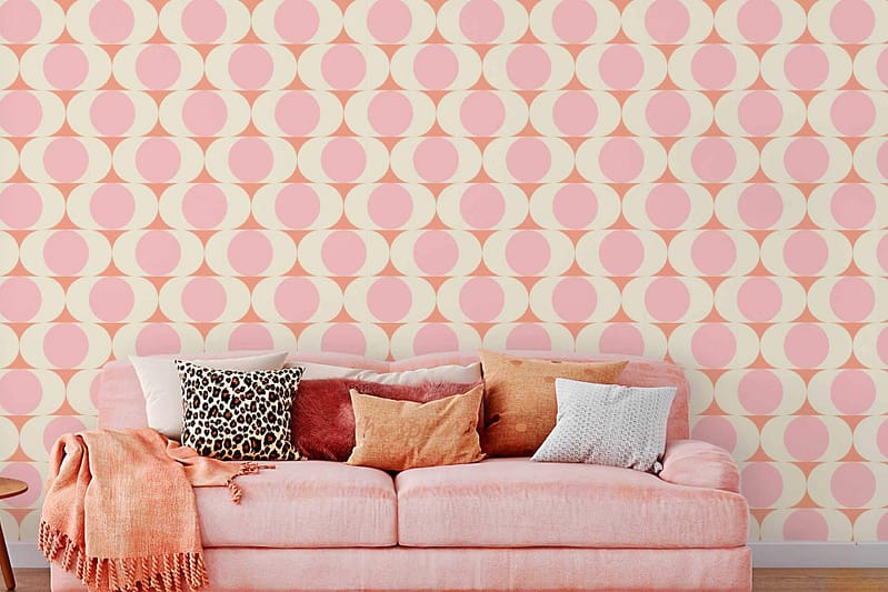 Retro geometric wallpaper featuring pink and cream circles.