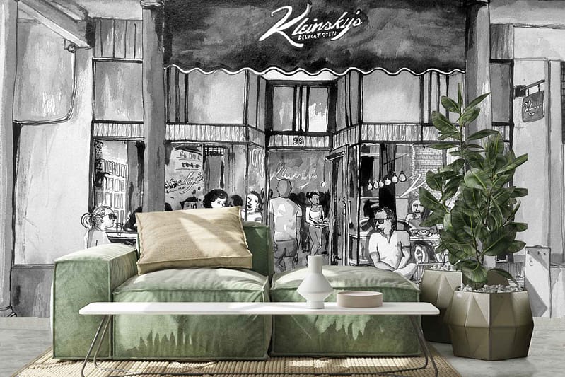 The ParkWall mural is a black-and-white depiction featuring people gathered at the entrance of a deli. It captures dynamic urban elements like bustling figures and storefront details, with high contrast between deep blacks and bright whites. The monochromatic palette highlights textures and patterns found in city life scenes.