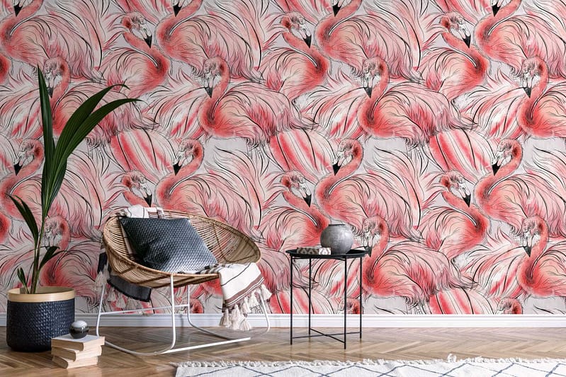 The wallpaper features a vibrant flamingo theme with pink flamingos, lush green tropical leaves, and hints of aqua blue water accents. These elements create a lively and exotic backdrop for the room.