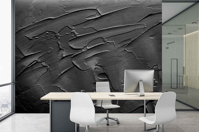 The wallpaper features a textured, dark abstract design with swirling patterns and deep hues. The primary colors include rich charcoal, subtle navy, and hints of metallic silver. This intricate design adds depth and visual interest to the space, making it both a focal point and a source of inspiration.