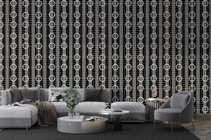 The wallpaper features a bold, geometric pattern with sharp lines and shapes in black and white. It consists of contrasting elements that create an eye-catching, modern design perfect for adding depth and interest to the living space. The monochrome palette of black and white makes it versatile while maintaining a striking aesthetic.