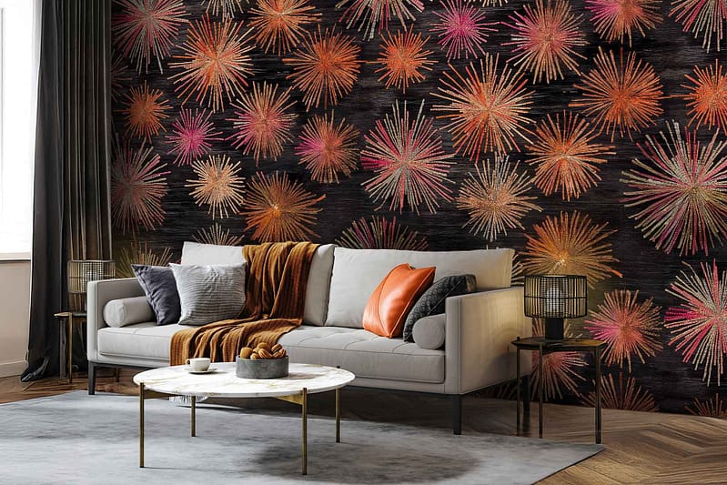 Vibrant wallpaper featuring a fireworks pattern in orange, pink, and gold tones.