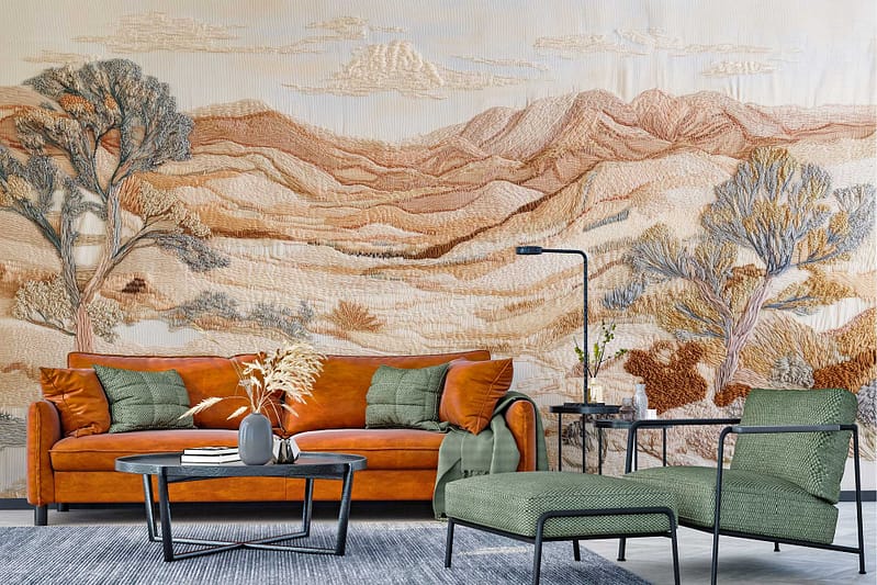 Textured mural wallpaper featuring a desert landscape with hills and trees in earthy tones.